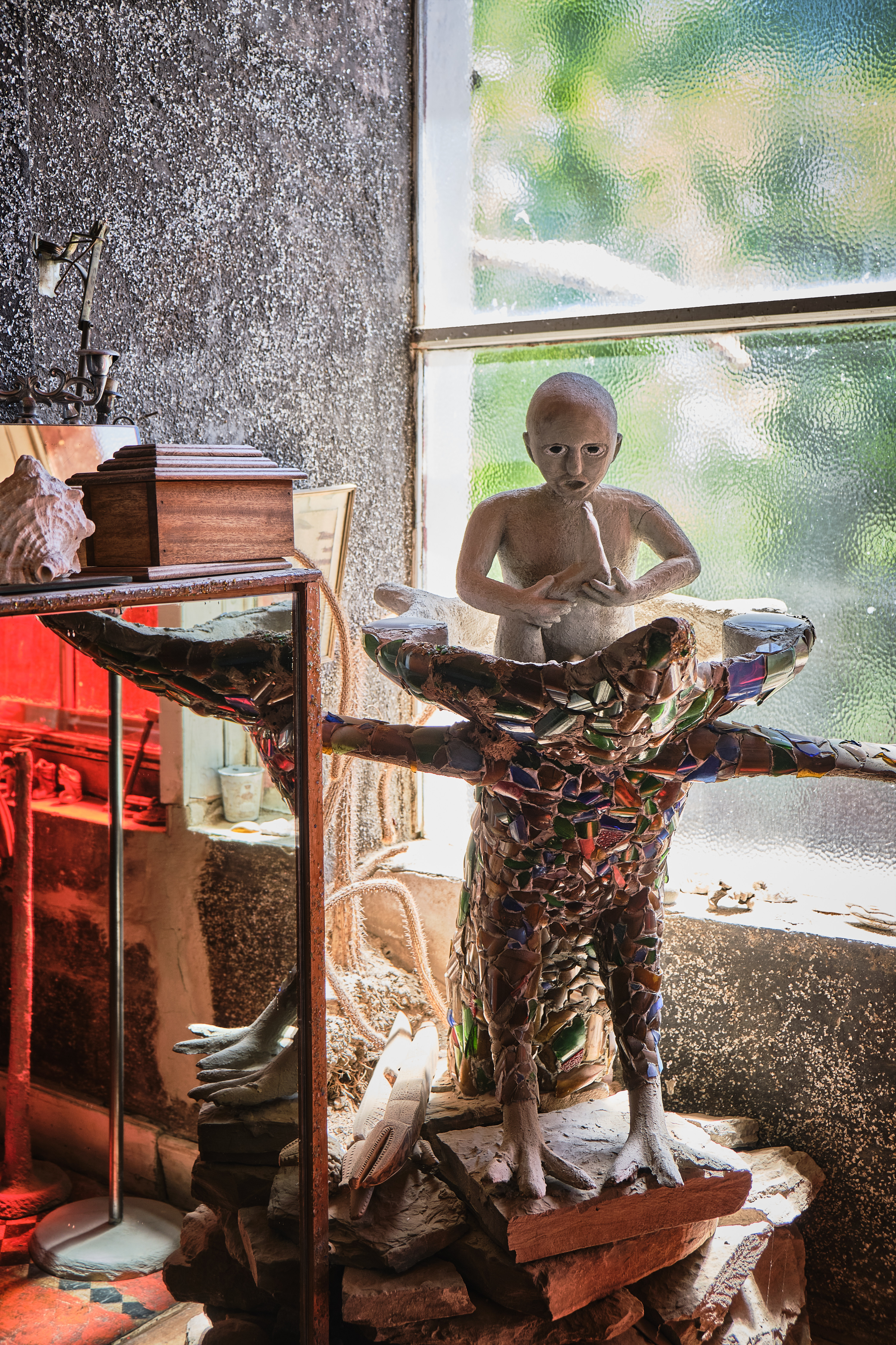 Interior sculpture inside the Owl House in Nieu-Bethesda, featuring mosaic glass artwork and handcrafted figures created in the spirit of Helen Martins' visionary environment.