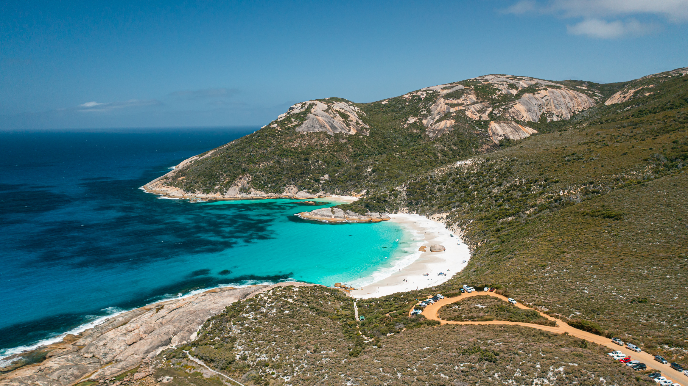 Aerial view of Little Beach, turquoise water, white sand, granite hills and beach access at Two Peoples Bay near Albany, Western Australia.