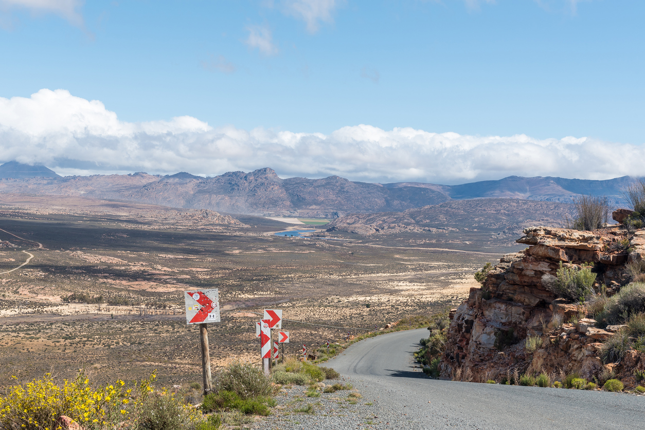 Road descending Katbakkies Pass with panoramic views across the Cederberg mountains and valleys in South Africa.