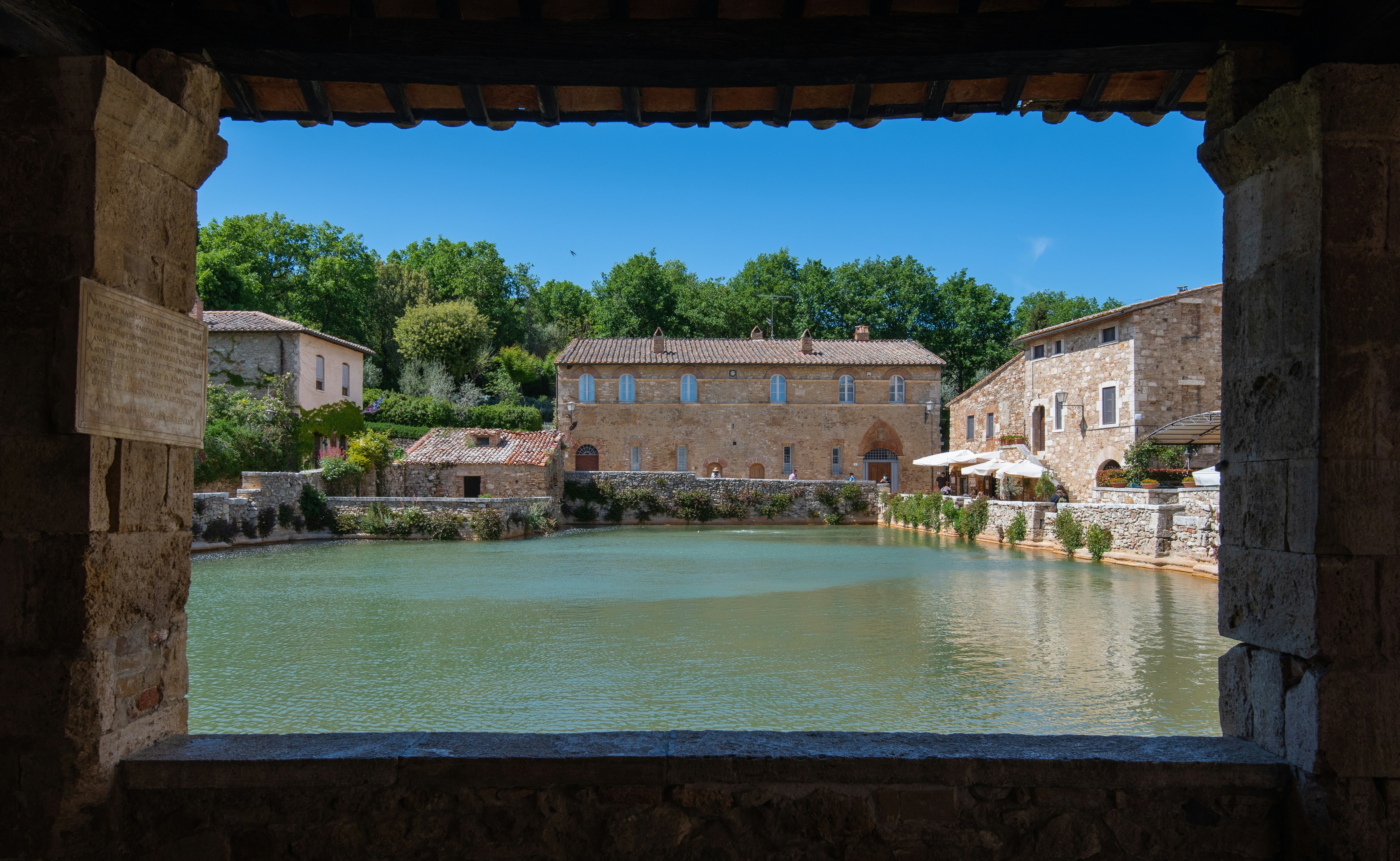 Historic thermal pool at Bagno Vignoni, a stone-lined hot spring occupying the village’s central square in Tuscany, Italy.