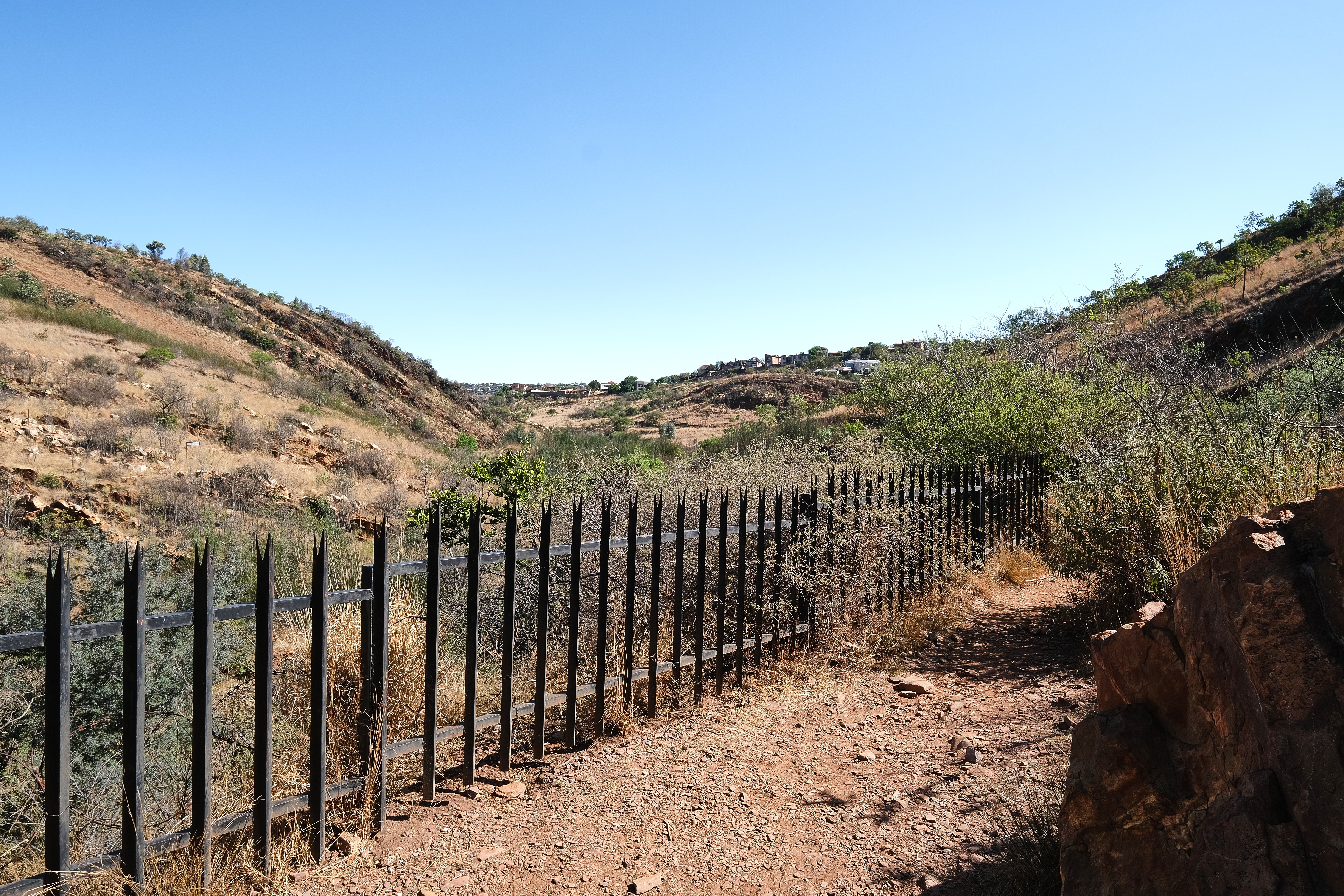 Walking path along a rocky valley in Walter Sisulu National Botanical Garden, Roodepoort.