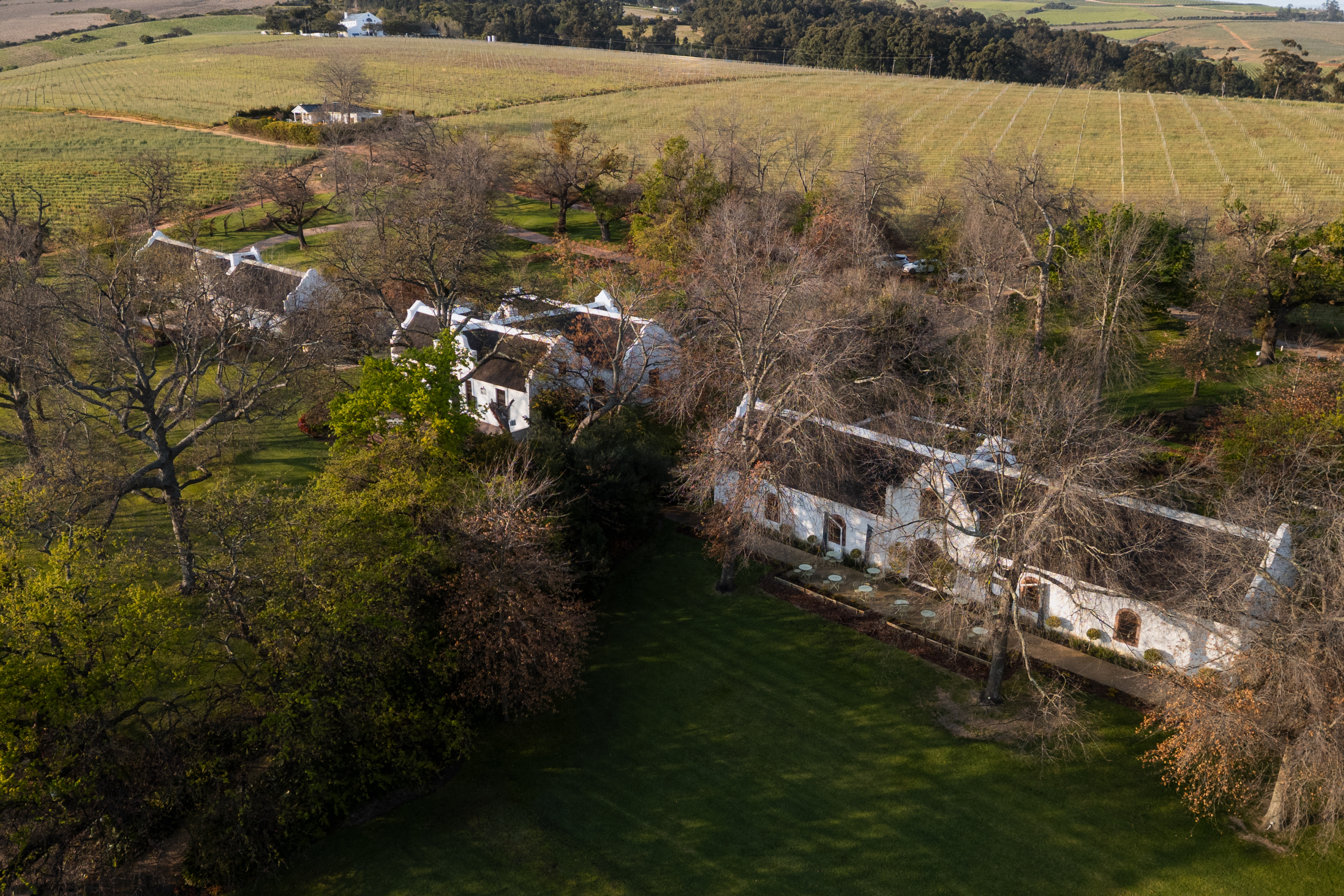 Aerial view of Rust en Vrede Estate buildings and vineyards in winter at Stellenbosch, South Africa.