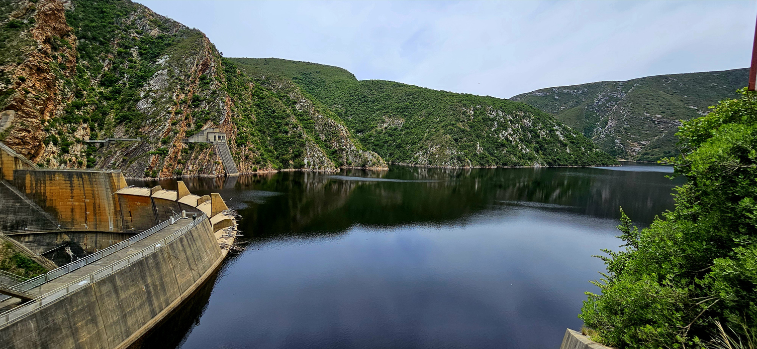 Kouga Dam wall and reservoir surrounded by the rugged Kouga Mountains in the Eastern Cape, South Africa.