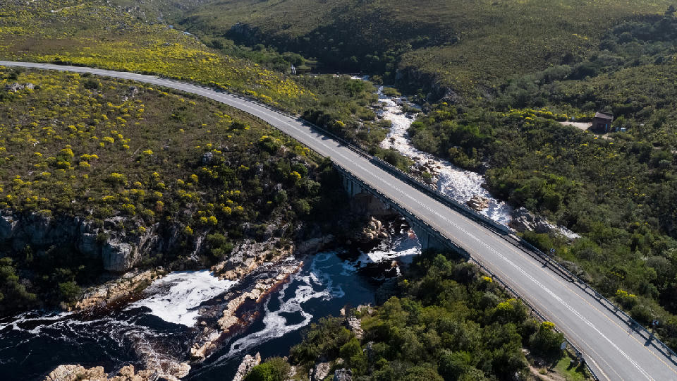 Aerial view of the Palmiet River bridge and rocky river gorge between Kleinmond and Betty’s Bay in the Kogelberg region, South Africa.