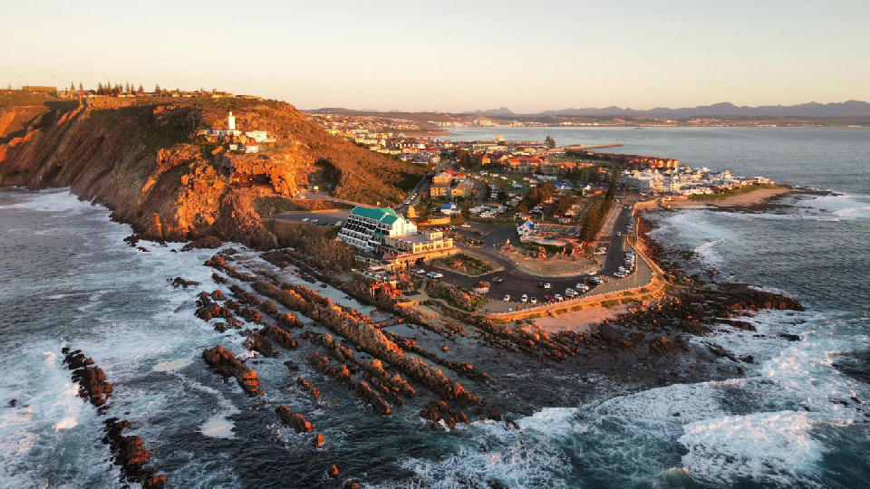 Aerial view of Mossel Bay coastline and St. Blaize Lighthouse at sunset on the Garden Route, South Africa