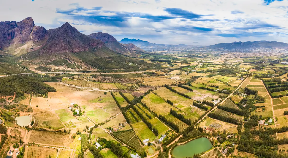 Panoramic aerial view of Paarl Valley vineyards and farmland near Du Toitskloof Pass in the Cape Winelands, Western Cape, South Africa.