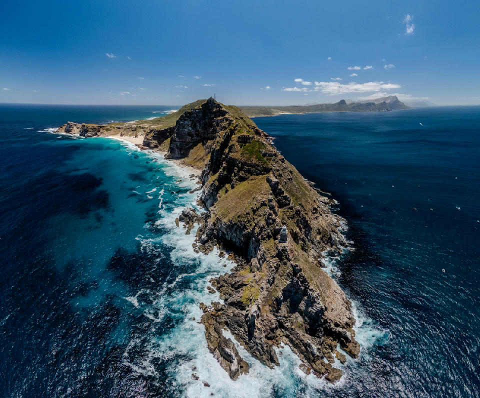 Aerial view of the Cape Point promontory and lighthouse on the southern Cape Peninsula in Table Mountain National Park, South Africa.