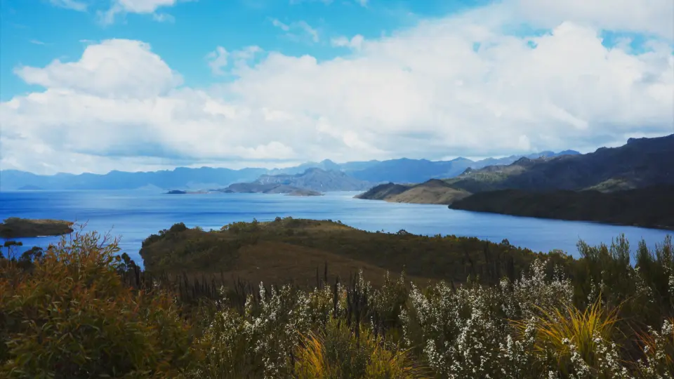 Wide view across Lake Pedder and surrounding mountains in southwest Tasmania.