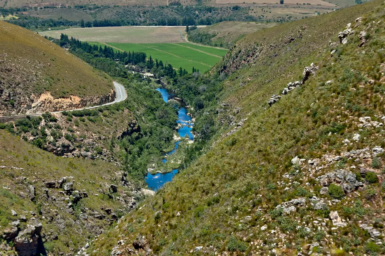 River gorge and winding road through Tradouw Pass in the Langeberg Mountains near Barrydale and Swellendam, Western Cape, South Africa.