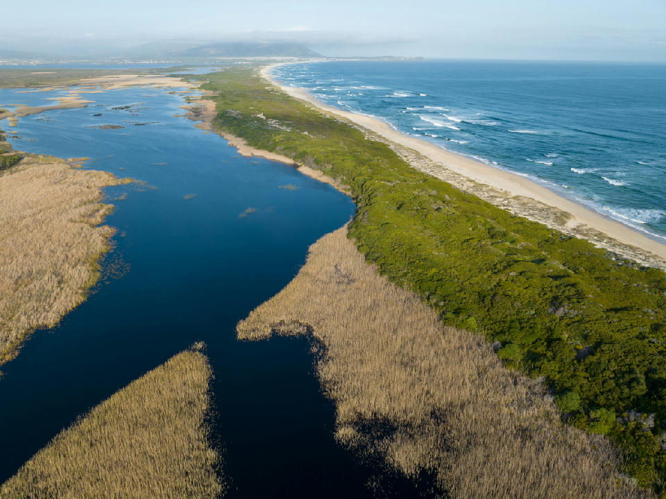 Aerial view of Rooisand estuary wetlands and coastline near Kleinmond in South Africa