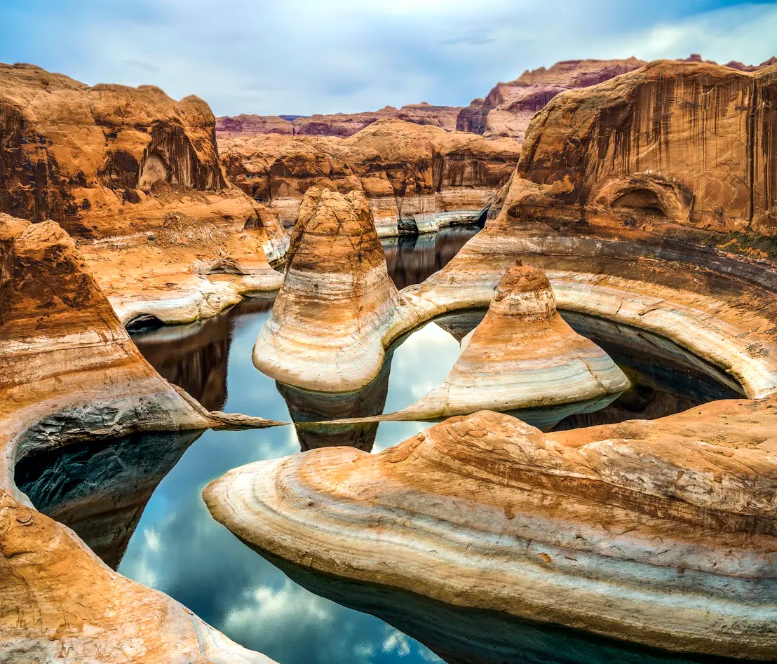 Reflection Canyon Lake Powell sandstone towers curved basin low water levels Glen Canyon Arizona