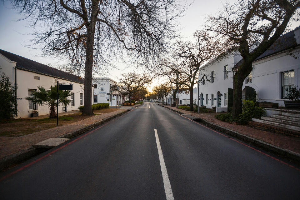 View along Dorp Street lined with historic Cape Dutch architecture in Stellenbosch town centre, Cape Winelands, Western Cape, South Africa.