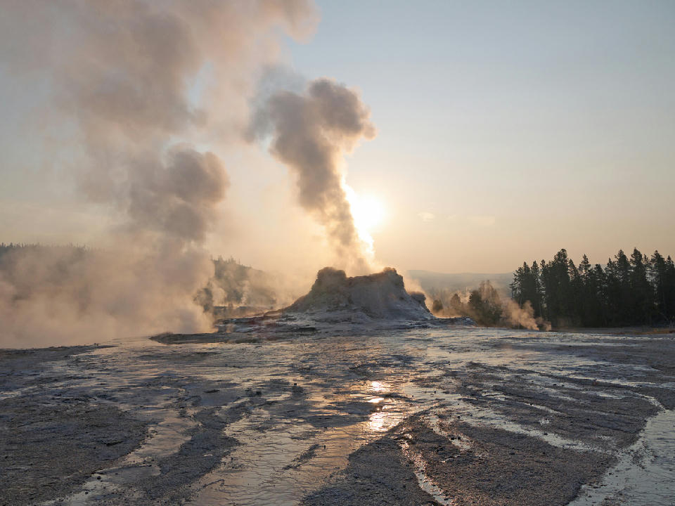 Castle Geyser steaming at sunrise Upper Geyser Basin Yellowstone