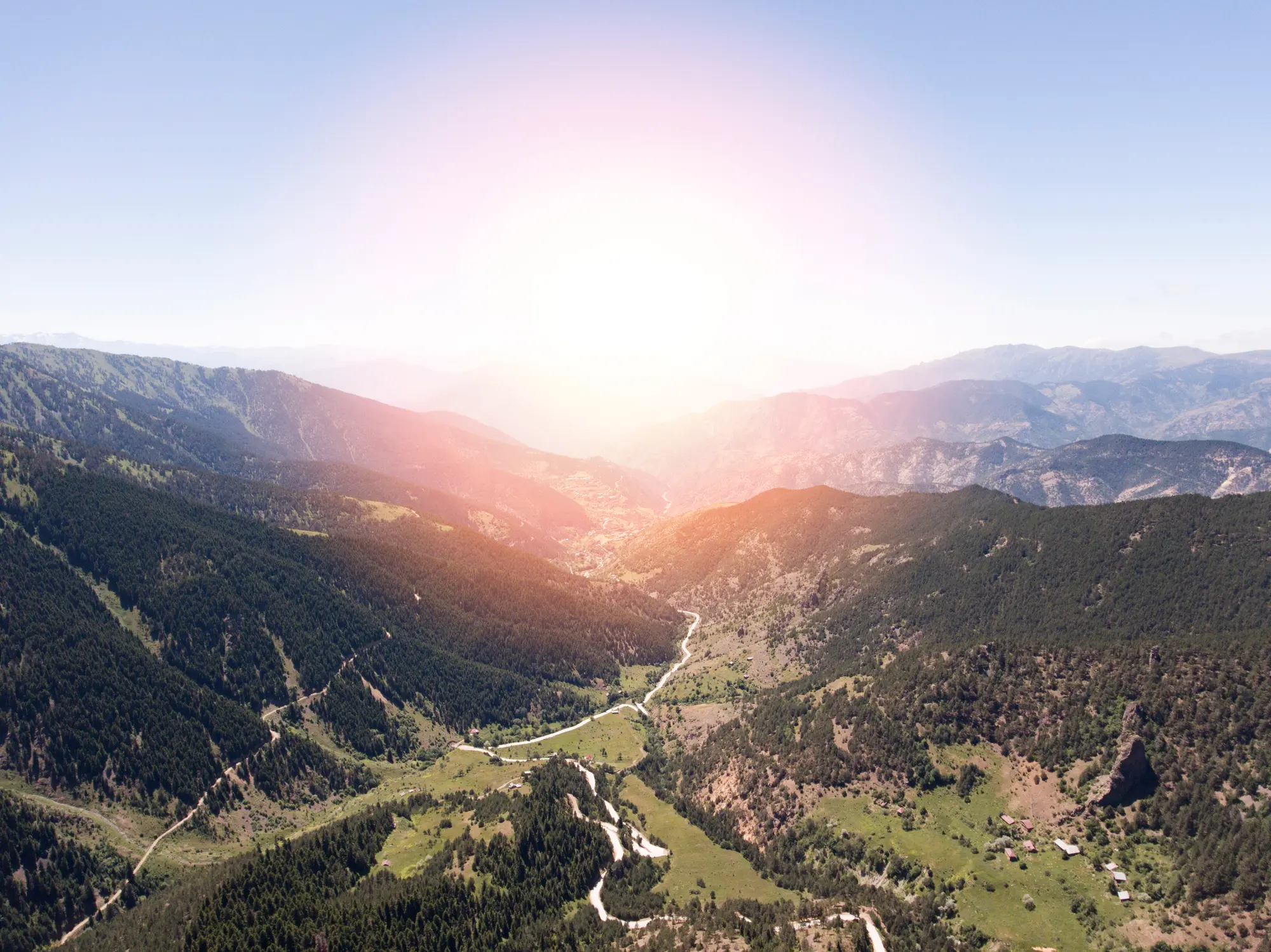 Elevated view across the forested Zigana Mountains and winding road through a deep valley near Trabzon, Turkey.