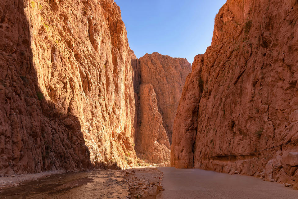 Towering canyon walls and river corridor inside Todra Gorge in Morocco