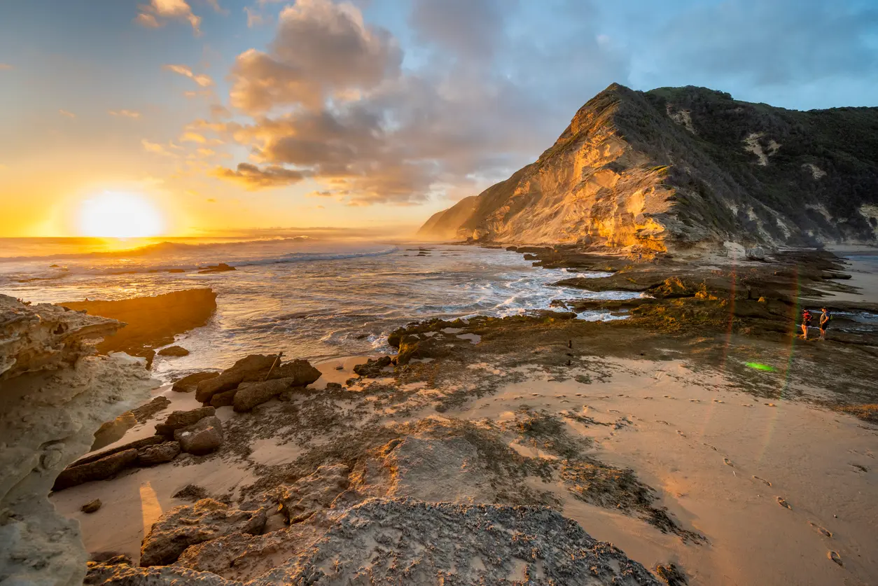Golden sunset over the fossilised dune cliffs and rocky shoreline of Gericke's Point near Sedgefield on South Africa's Garden Route.