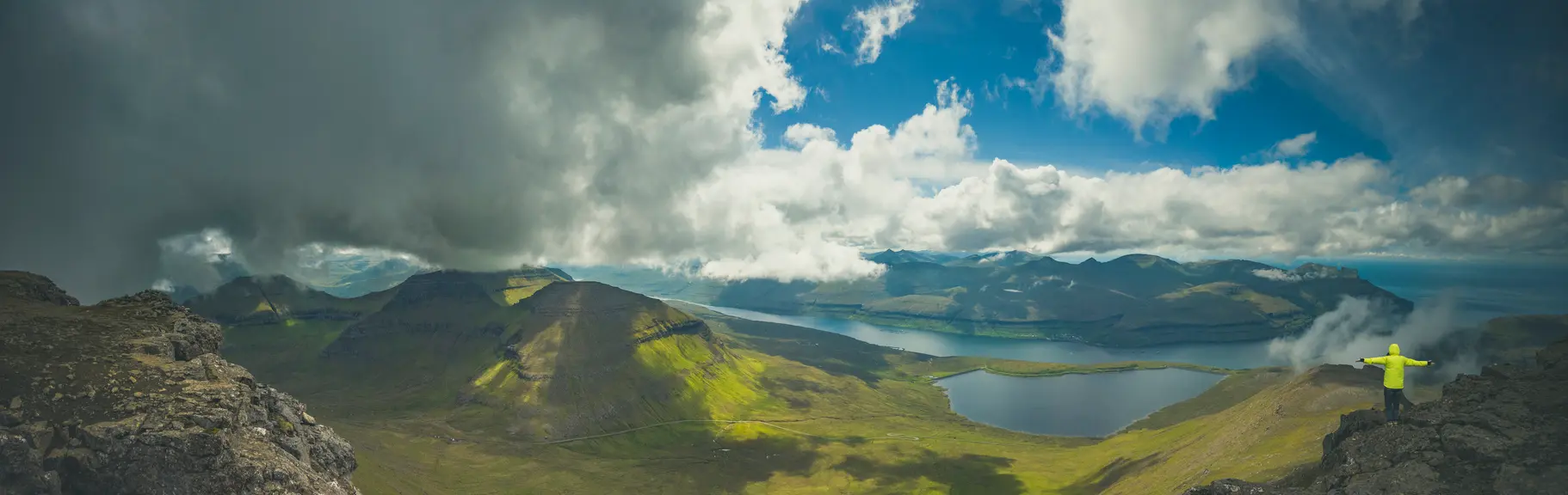 Panoramic view from Slættaratindur summit across fjords and mountains on Eysturoy, Faroe Islands.