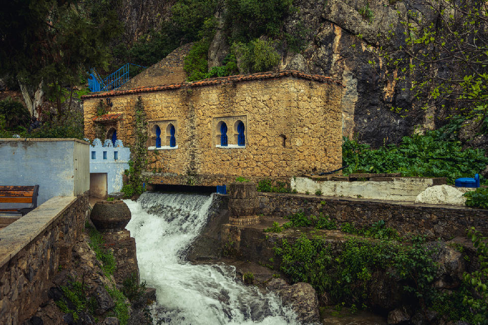 Traditional stone building beside the Ras El Maa waterfalls in Chefchaouen, Morocco