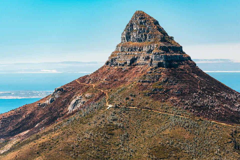 Lion’s Head mountain with visible hiking trail and ocean backdrop in Cape Town, South Africa.