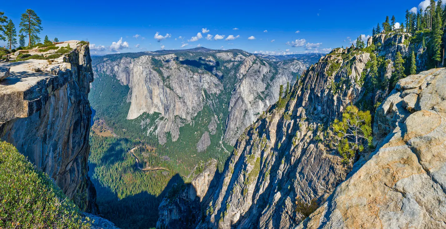 Cliff edge view from Taft Point looking across Yosemite Valley to El Capitan