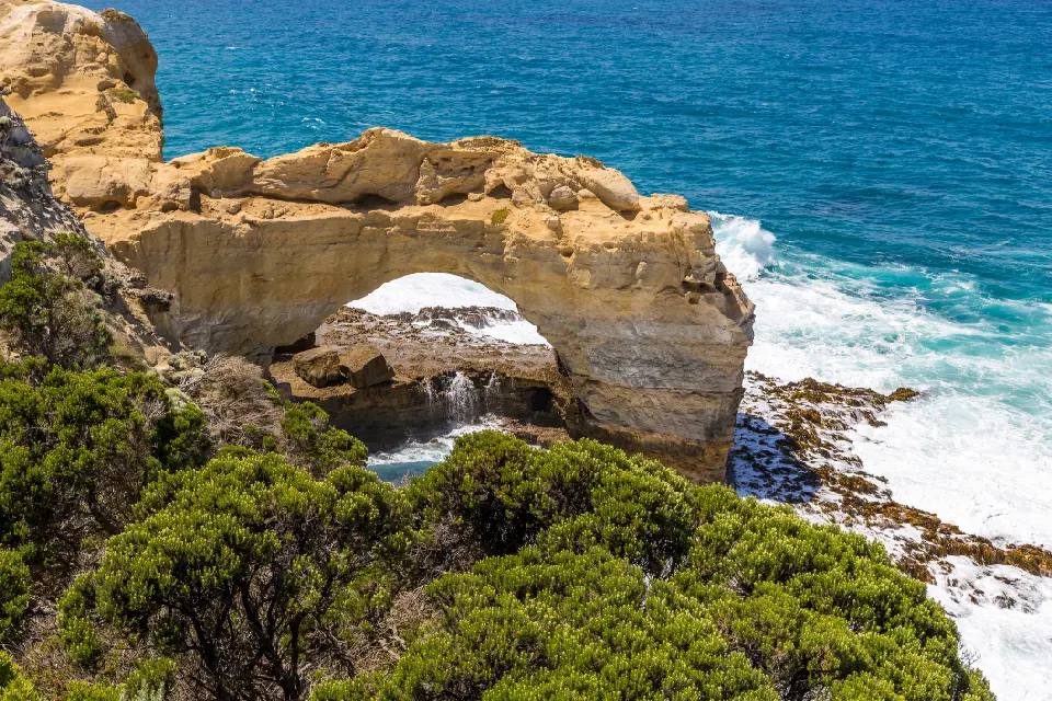 Limestone formation known as The Arch above breaking waves on Victoria’s Great Ocean Road.