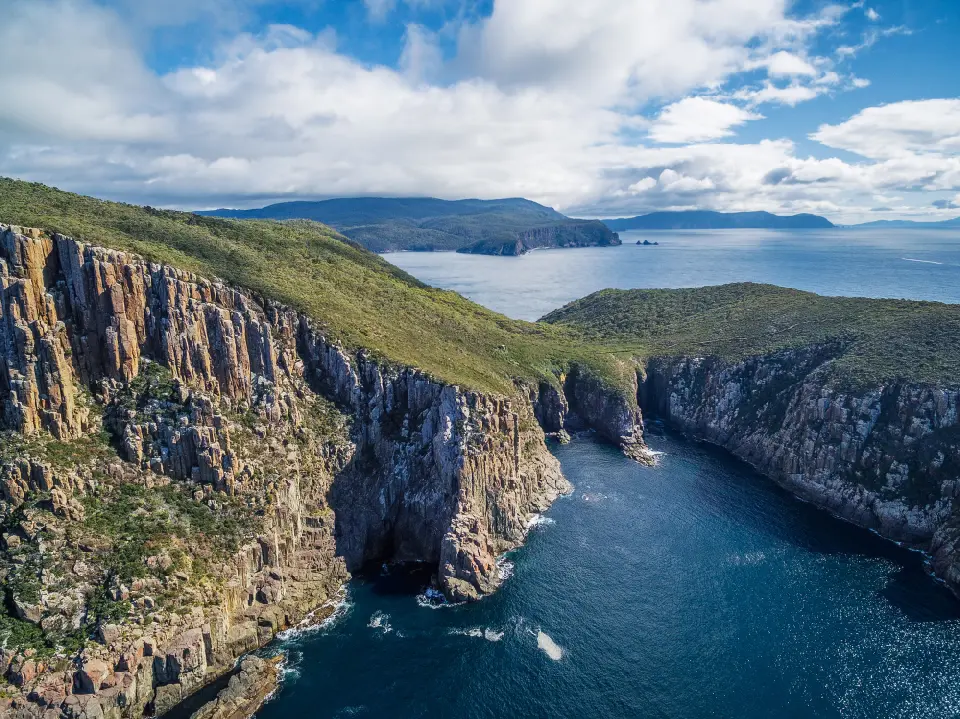 Elevated view of the dolerite sea cliffs and rugged coastline at Cape Hauy, Tasmania.