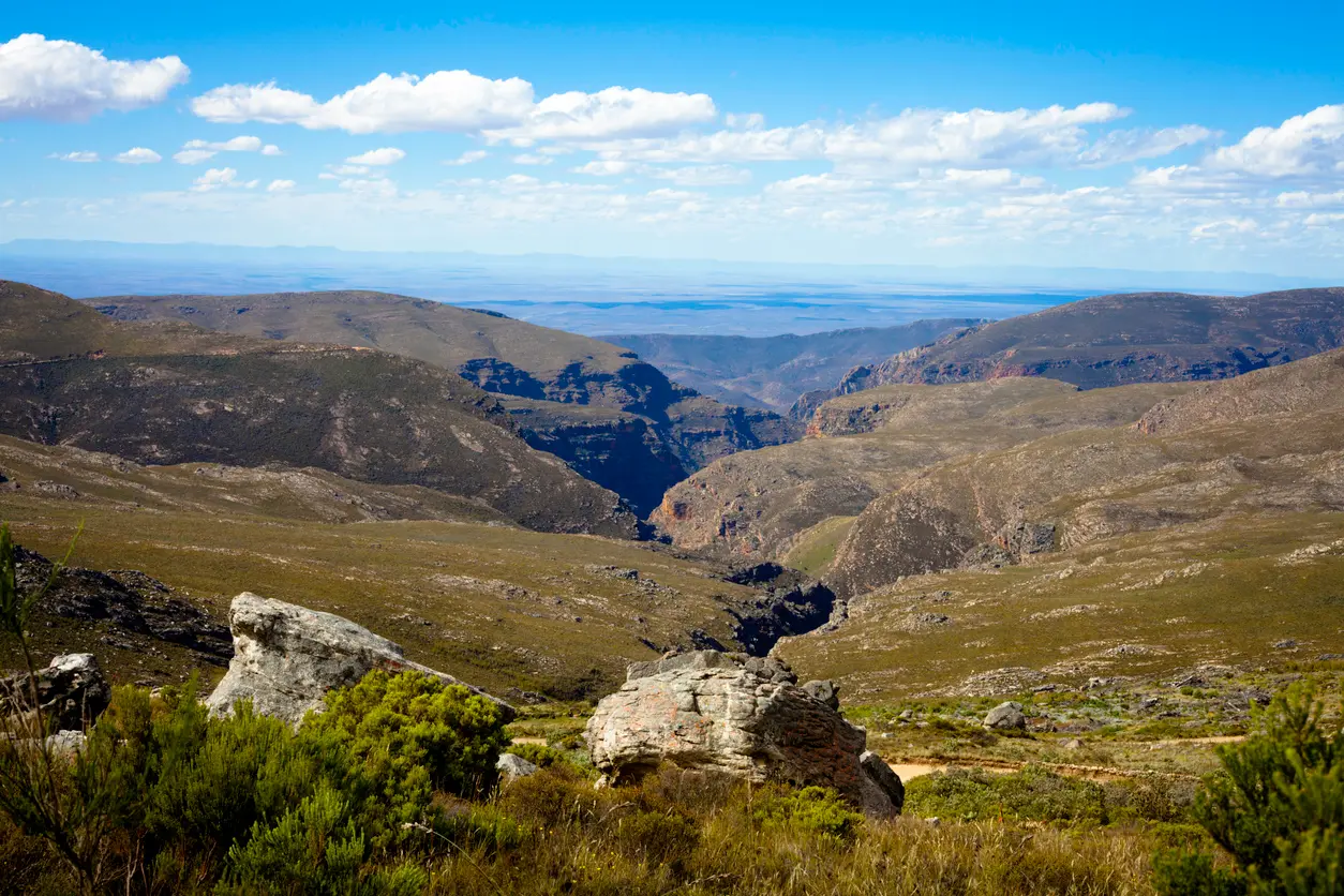 Expansive mountain and canyon landscape in the Swartberg Mountains of the Klein Karoo in South Africa.