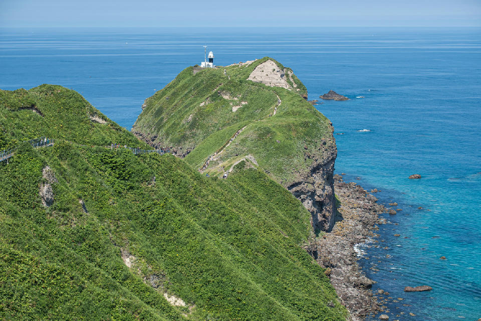 Cape Kamui lighthouse on a narrow coastal ridge on the Shakotan Peninsula, Hokkaido, Japan.