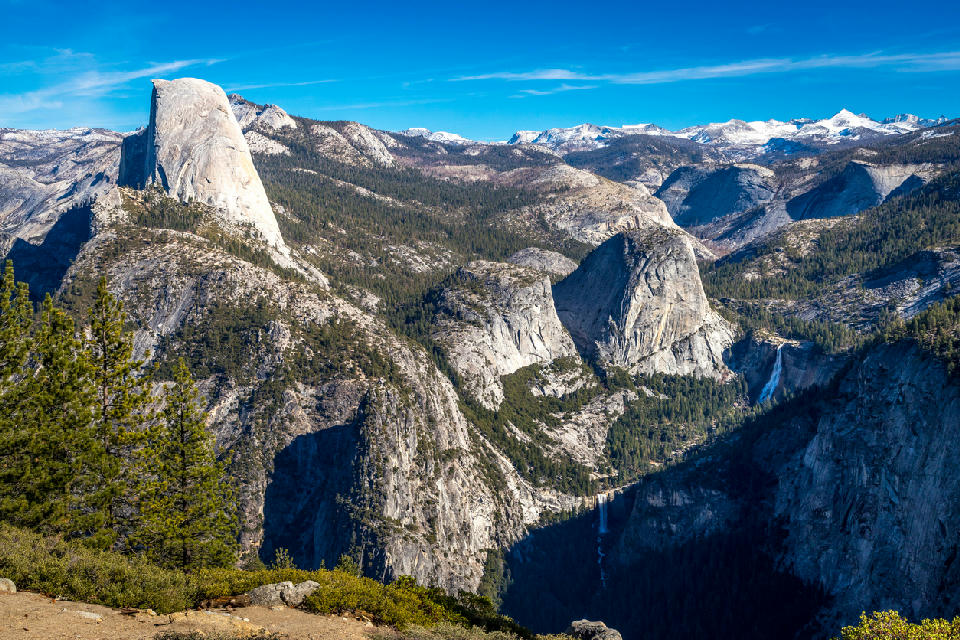 Washburn Point view of Half Dome and Nevada Fall in Yosemite National Park, California.