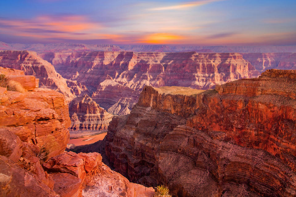 Grand Canyon layered canyon walls at sunset with Colorado River below, Arizona, USA