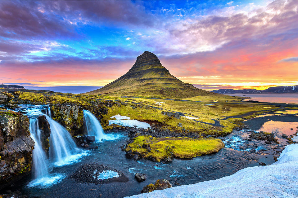 Kirkjufell mountain at sunrise on the Snæfellsnes Peninsula, Iceland.