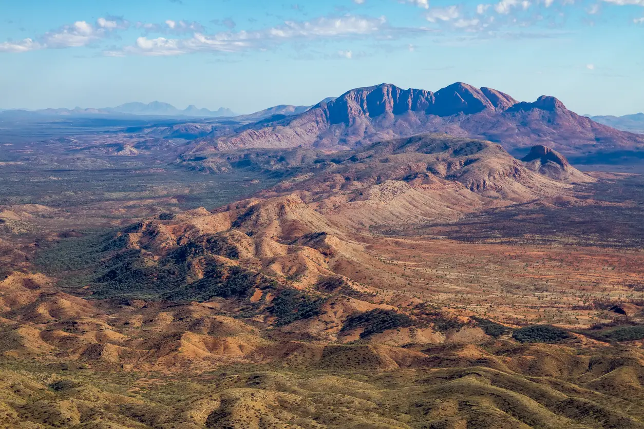 Sweeping view across rugged ridges and mountain peaks of the West MacDonnell Ranges.