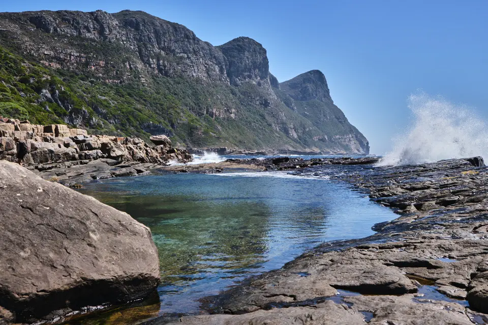 Natural tidal pool at Venus Pools along the rocky coastline of the Cape of Good Hope in Table Mountain National Park, South Africa.