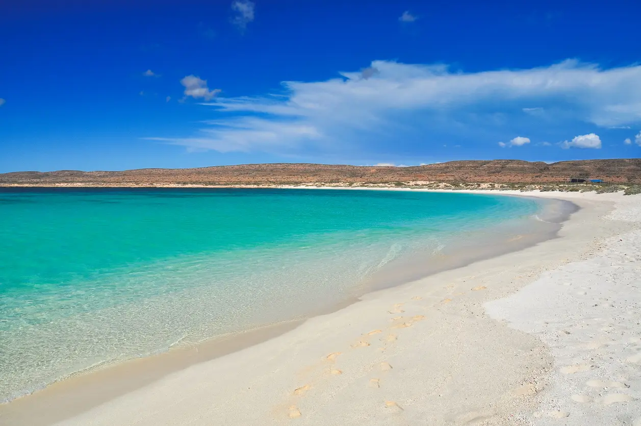 White sand and clear turquoise water at Turquoise Bay beside Ningaloo Reef.