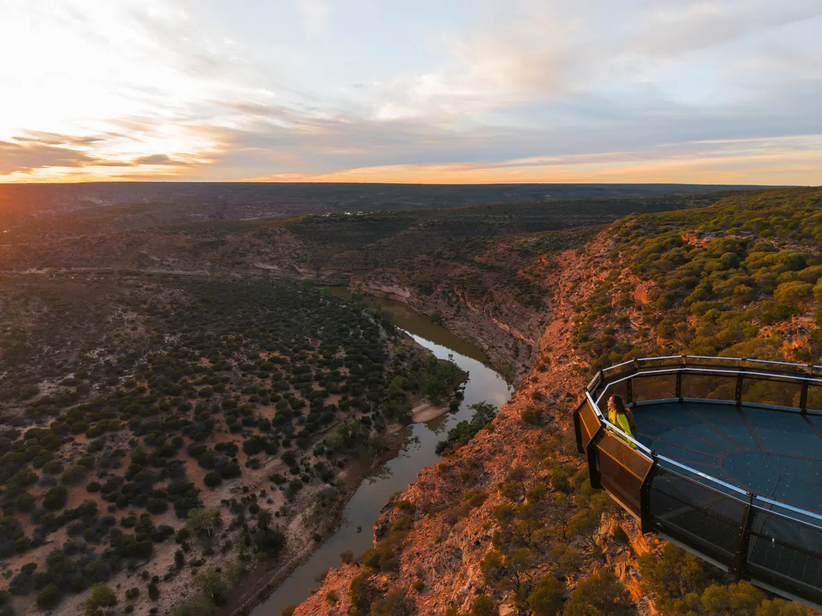 Kalbarri Skywalk extends over the Murchison River gorge in warm sunset light.