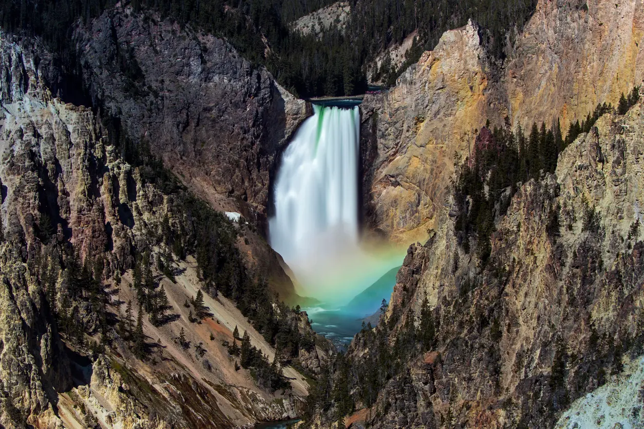 Lower Falls of the Yellowstone River with rainbow in mist viewed from Artist Point