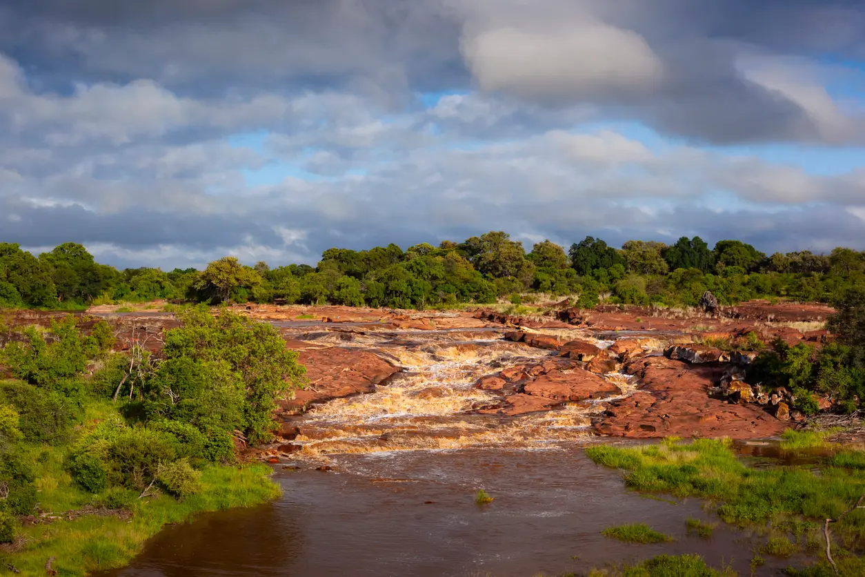 Red Rocks rapids and red sandstone formations on the Shingwedzi River near Shingwedzi Rest Camp in Kruger National Park.