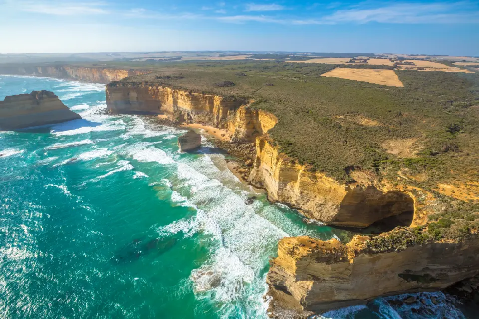 Aerial view of limestone cliffs, sea stacks and turquoise ocean along the Shipwreck Coast near Port Campbell, Victoria.