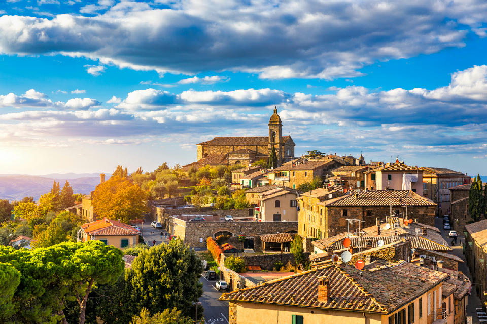 View of the medieval hill town of Montalcino rising above the Tuscan countryside.