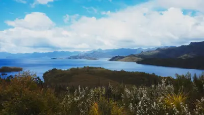 Wide view across Lake Pedder and surrounding mountains in southwest Tasmania.
