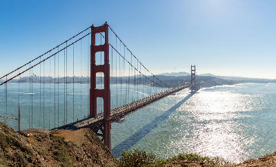 Golden Gate Bridge in morning light from Battery Spencer with San Francisco skyline across the bay