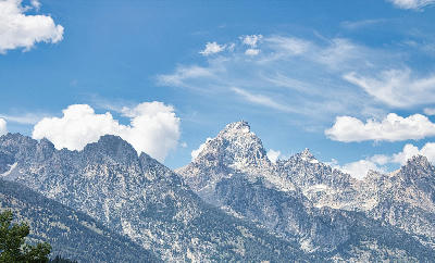 View of Grand Teton and surrounding peaks from Teton Glacier Turnout, Grand Teton National Park, Wyoming, USA.