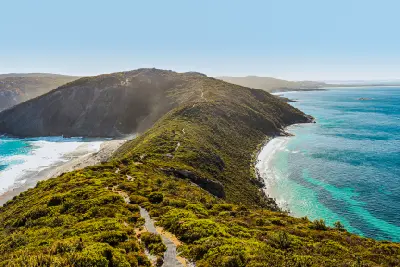 Bald Head walking trail crossing a coastal ridge between turquoise bays near Albany, Western Australia.