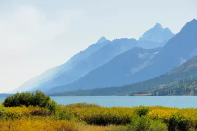 Jackson Lake with layered Grand Teton Alpine Lakes system mountains fading into the distance in Wyoming.