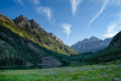 Summer meadow with Maroon Lake and Maroon Bells in the background near Aspen Colorado