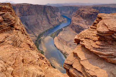 Horseshoe Bend canyon showing the Colorado River meander between steep sandstone cliffs near Page Arizona