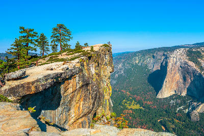Taft Point cliff edge overlooking Yosemite Valley with El Capitan and Yosemite Falls in Yosemite National Park, California.