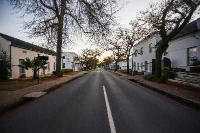 View along Dorp Street lined with historic Cape Dutch architecture in Stellenbosch town centre, Cape Winelands, Western Cape, South Africa.