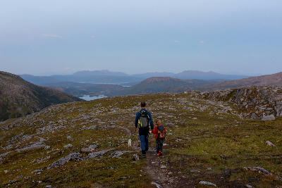 hikers on Grytetippen trail Senja Norway mountain plateau terrain