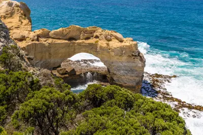Limestone formation known as The Arch above breaking waves on Victoria’s Great Ocean Road.